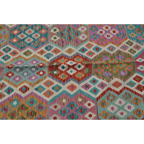 978 - A 20th century Anatolian Turkish Kilim carpet floor rug. The rug having cream ground with polychrome... 