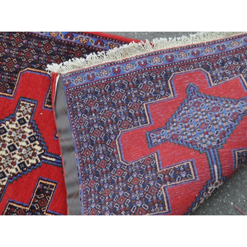 989 - A 20th century North West Persian Senneh runner carpet floor rug. The runner featuring a stepped geo... 