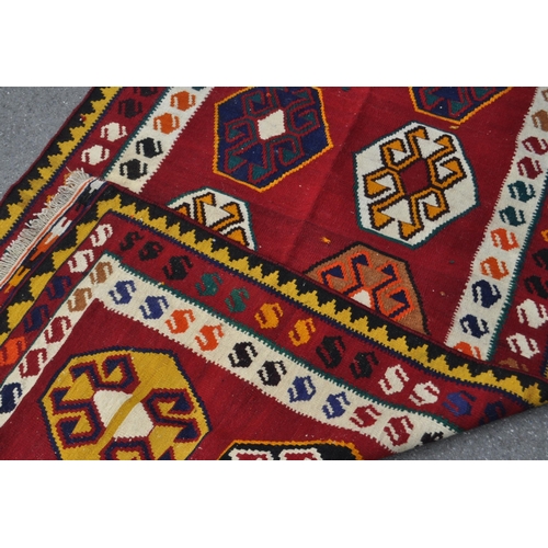 990 - A 20th century South West Persian Qashqai kilim carpet floor rug. The kilim featuring a red central ... 