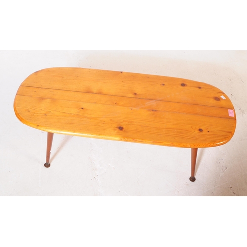 611 - British Modern Design - A vintage 20th century pine occasional / coffee table. Curved rectangular fo... 