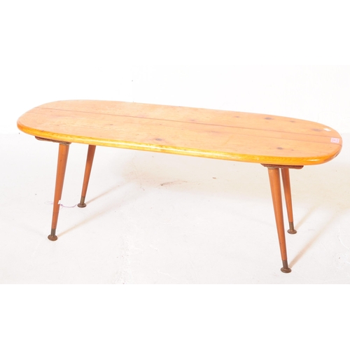 611 - British Modern Design - A vintage 20th century pine occasional / coffee table. Curved rectangular fo... 