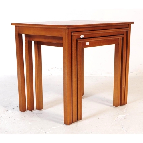 612 - British Modern Design - Retro mid 20th century teak nest of table. Rectangular form with tapering sq... 