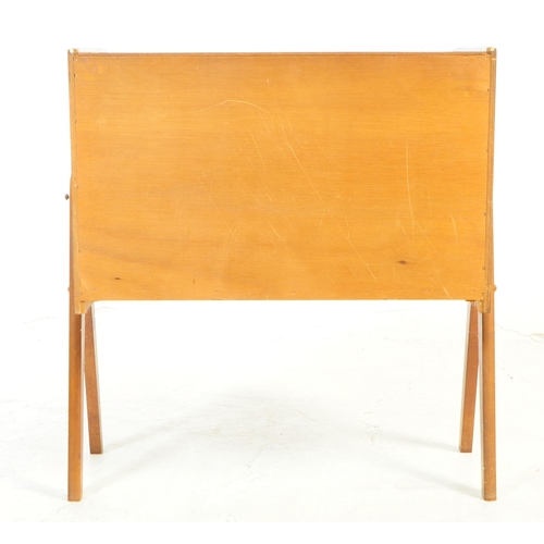 730 - British Modern Design - A mid 20th century teak veneer record cabinet. The cabinet raised on tapered... 