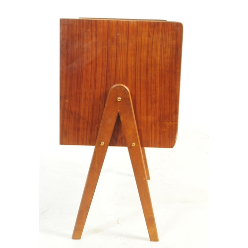 730 - British Modern Design - A mid 20th century teak veneer record cabinet. The cabinet raised on tapered... 