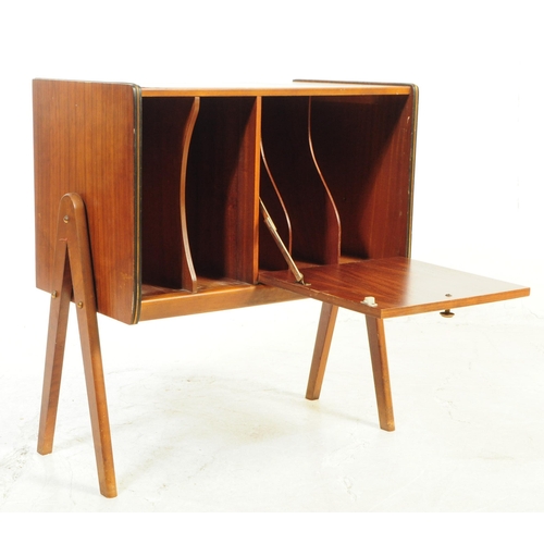 730 - British Modern Design - A mid 20th century teak veneer record cabinet. The cabinet raised on tapered... 