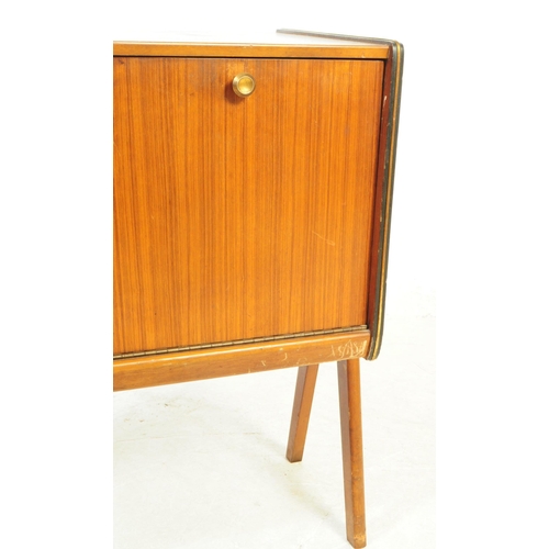 730 - British Modern Design - A mid 20th century teak veneer record cabinet. The cabinet raised on tapered... 