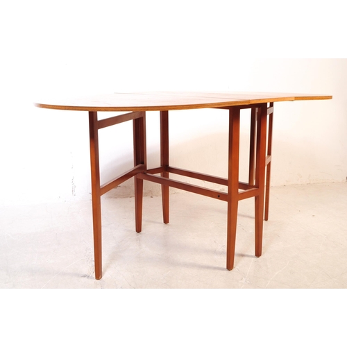 732 - British Modern Design - A mid 20th century teak wood drop leaf dining table. The table of space save... 