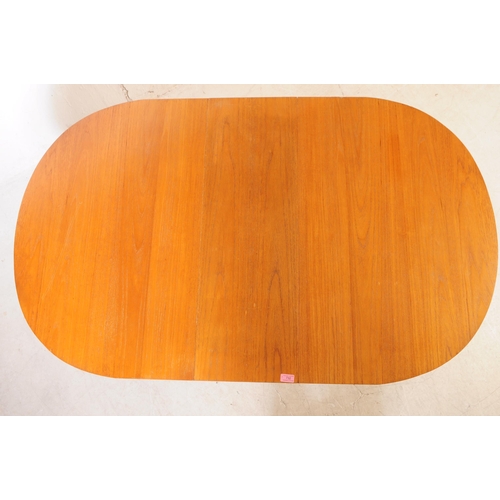 732 - British Modern Design - A mid 20th century teak wood drop leaf dining table. The table of space save... 