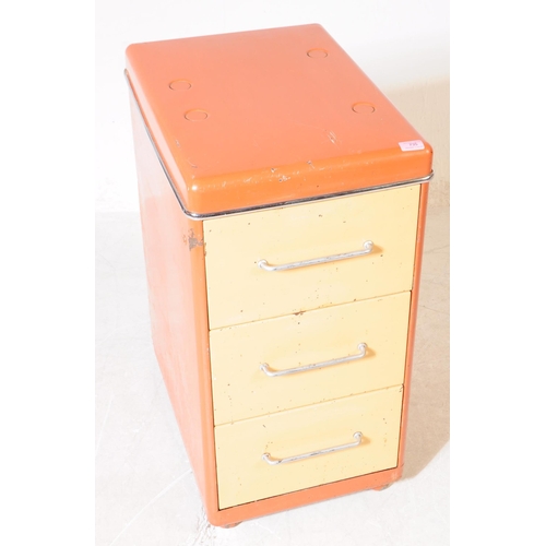 735 - A retro 20th century circa 1970s filing cabinet having painted orange and cream body with a bank of ... 