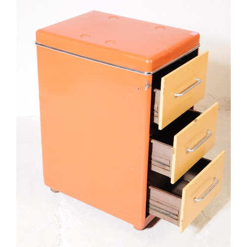 735 - A retro 20th century circa 1970s filing cabinet having painted orange and cream body with a bank of ... 