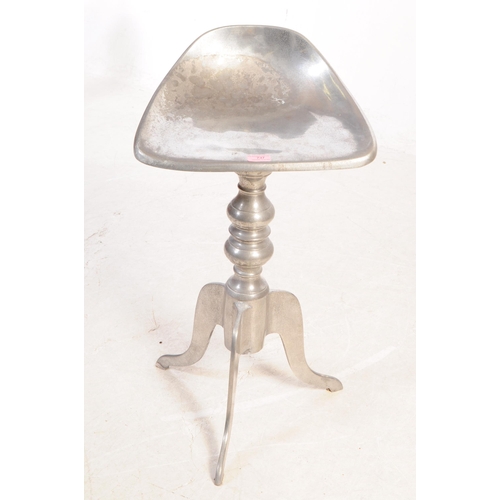 737 - A vintage 20th century Italian chrome metal stool having saddle type seat over pedestal tripod base ... 