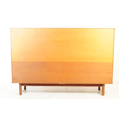 738 - British Modern Design - A mid 20th century teak wood highboard sideboard. The sideboard raised on sq... 