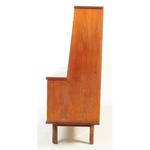 738 - British Modern Design - A mid 20th century teak wood highboard sideboard. The sideboard raised on sq... 