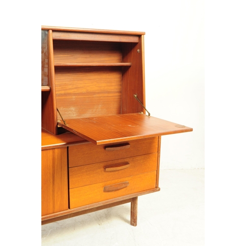 738 - British Modern Design - A mid 20th century teak wood highboard sideboard. The sideboard raised on sq... 