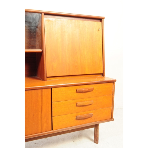 738 - British Modern Design - A mid 20th century teak wood highboard sideboard. The sideboard raised on sq... 