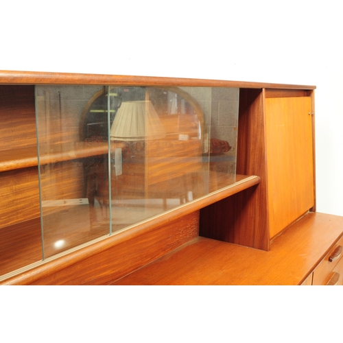 738 - British Modern Design - A mid 20th century teak wood highboard sideboard. The sideboard raised on sq... 