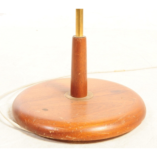 742 - A mid Century retro brass and teak floor standing standard lamp. Having circular wood base and centr... 