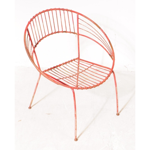 743 - A vintage 20th century painted wire metal garden outdoors chair and table painted in a red colourway... 