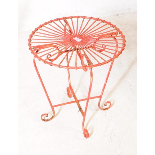 743 - A vintage 20th century painted wire metal garden outdoors chair and table painted in a red colourway... 