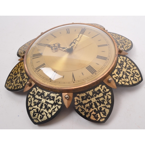 740 - Metamec - A 20th Century vintage Metamec wall clock having brass circular face with gilt decorated f... 