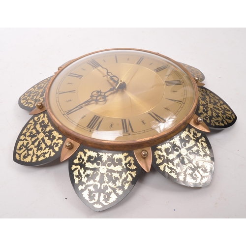 740 - Metamec - A 20th Century vintage Metamec wall clock having brass circular face with gilt decorated f... 