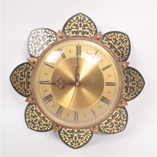 740 - Metamec - A 20th Century vintage Metamec wall clock having brass circular face with gilt decorated f... 