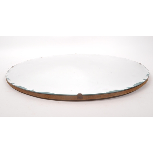 875 - A mid Century Art Deco style circular wall hanging mirror having patterned rounded bevelled edge des... 