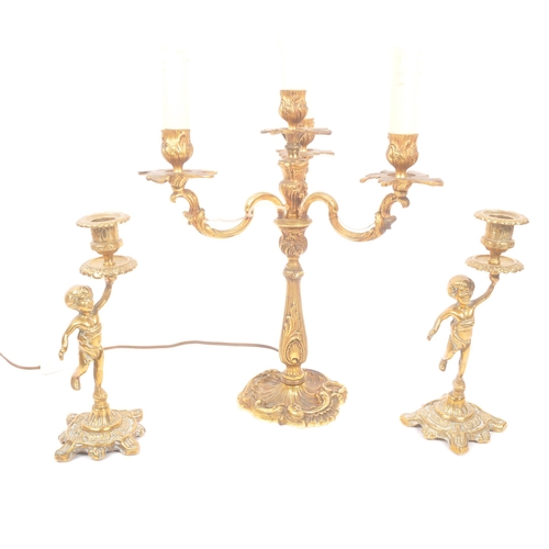 1129 - A mid Century circa 1940s brass candelabra lamp having four arms with foliate / acanthus design. Tog... 