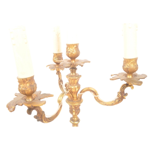 1129 - A mid Century circa 1940s brass candelabra lamp having four arms with foliate / acanthus design. Tog... 