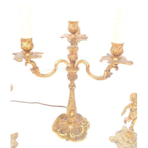 1129 - A mid Century circa 1940s brass candelabra lamp having four arms with foliate / acanthus design. Tog... 