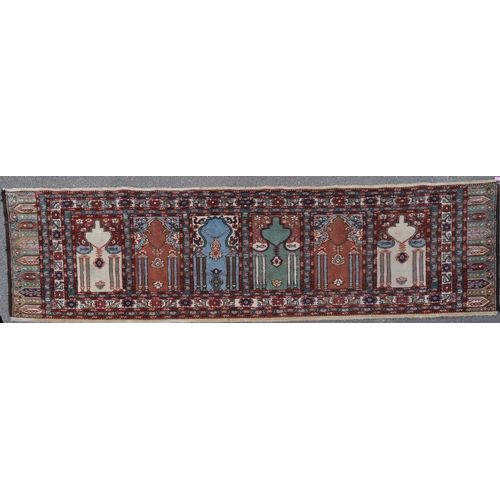 887 - A 20th century Turkish Kayseri / Saff manner Islamic prayer runner carpet rug. The rug featuring win... 