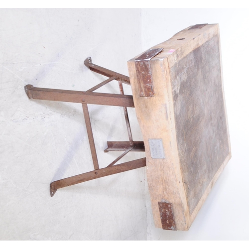 963 - A mid 20th century large butchers block. The block raised on a metal trestle style base, with metal ... 