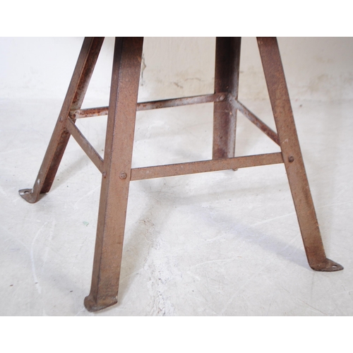 963 - A mid 20th century large butchers block. The block raised on a metal trestle style base, with metal ... 