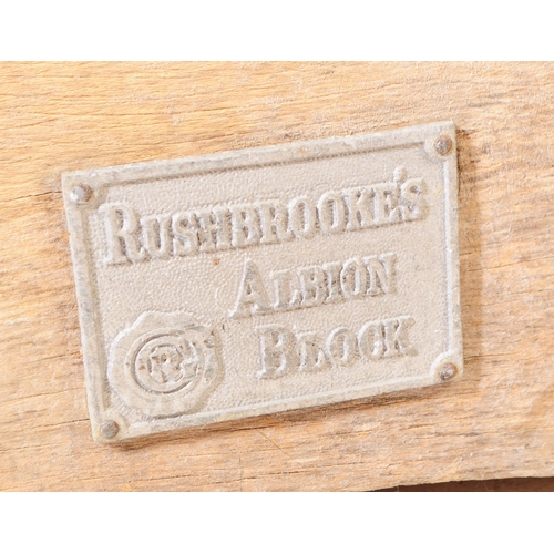 963 - A mid 20th century large butchers block. The block raised on a metal trestle style base, with metal ... 