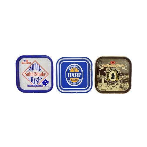 121 - Breweriana - a selection of three vintage late 20th century pub advertising tin trays. The trays inc... 