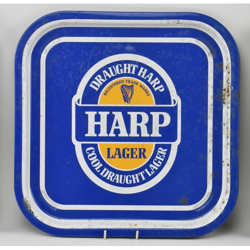 121 - Breweriana - a selection of three vintage late 20th century pub advertising tin trays. The trays inc... 