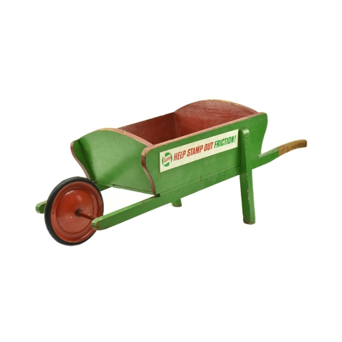 23 - Castrol - A vintage 20th century green painted advertising wooden wheelbarrow. The barrow with label... 