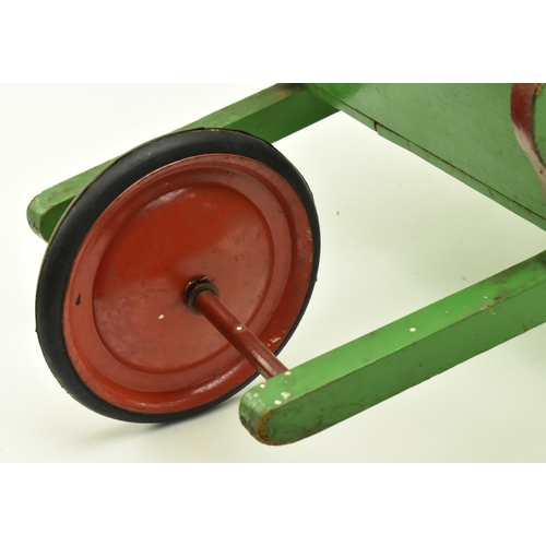 23 - Castrol - A vintage 20th century green painted advertising wooden wheelbarrow. The barrow with label... 