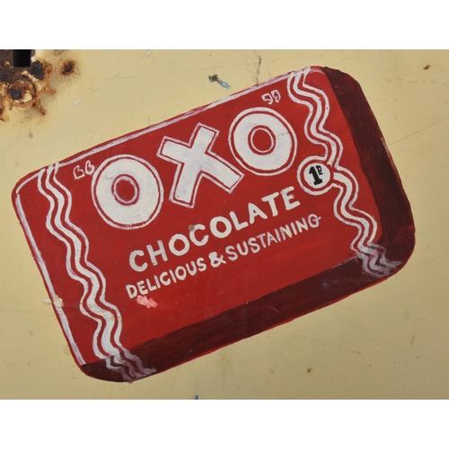 90 - OXO - A vintage mid 20th century OXO Chocolate vending machine. The wall mounted machine of slender ... 