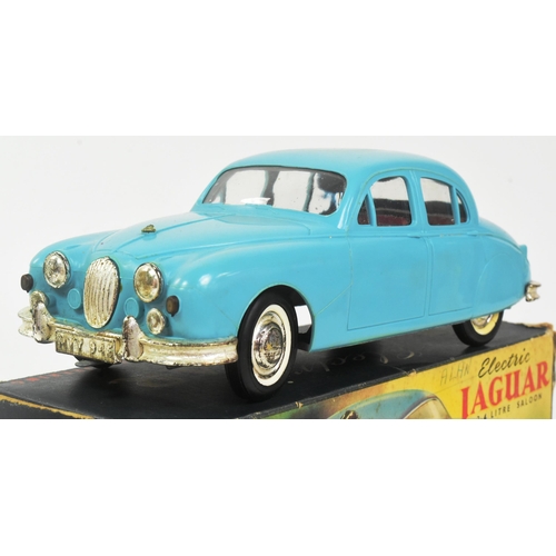 145 - Mettoy - a vintage Mettoy made battery operated electric Jaguar 2.4 Litre Saloon car. Turquoise plas... 