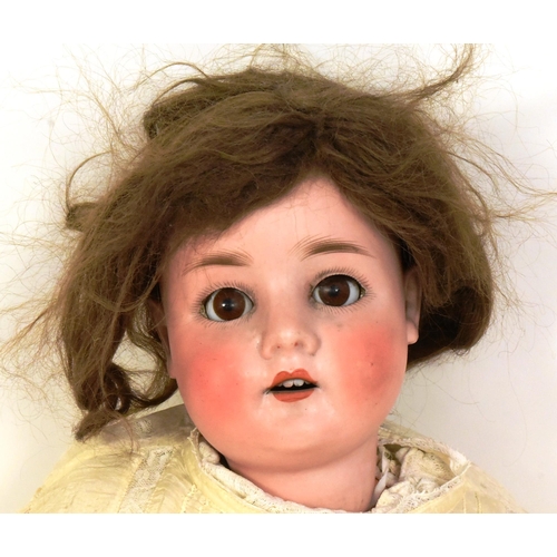 196 - An early 20th Century German Simon & Halbig made bisque headed doll. Brown flirty eyes, finely paint... 