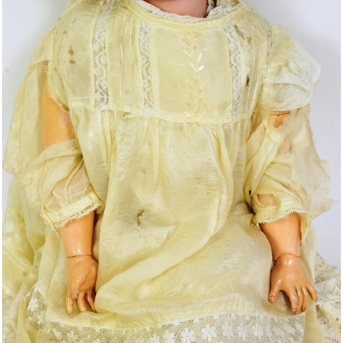 196 - An early 20th Century German Simon & Halbig made bisque headed doll. Brown flirty eyes, finely paint... 