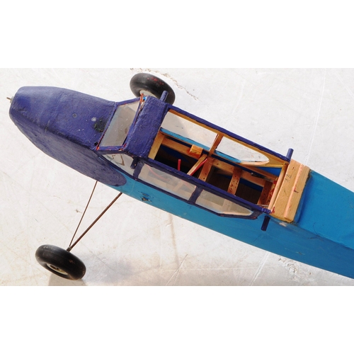 212 - Radio Controlled Plane - a vintage model RC plane fuselage and wings. Wooden construction, in blue, ... 