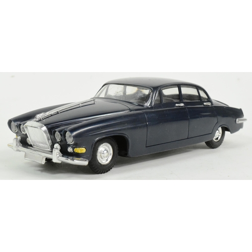 22 - A vintage Empire Made (Telsalda) Jaguar Mark 10 Saloon friction motor model car. Detailed model with... 