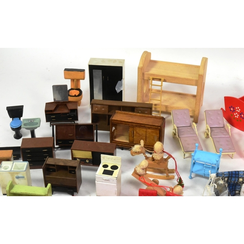 220 - Doll's House Furniture - a large quantity of assorted scale vintage Dolls House furniture. Various d... 