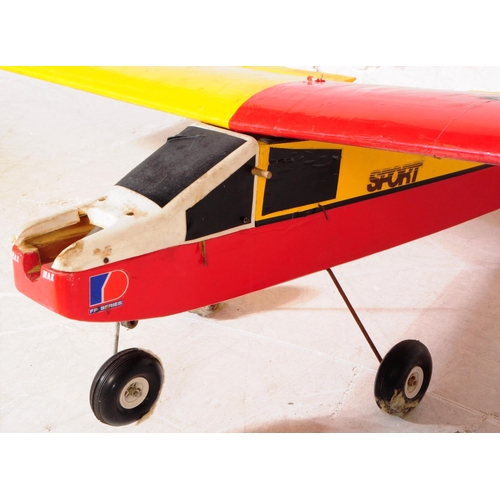 222 - Radio Controlled Plane - a vintage model RC plane fuselage and wings. Wooden construction, in red an... 