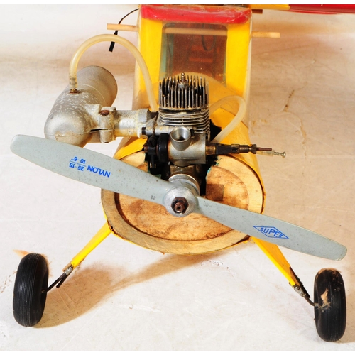 224 - Radio Controlled Plane - a vintage model RC plane fuselage and wings. Wooden construction, in yellow... 