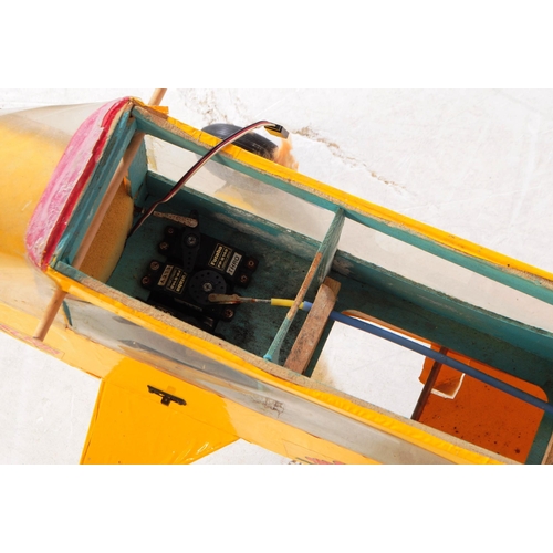 224 - Radio Controlled Plane - a vintage model RC plane fuselage and wings. Wooden construction, in yellow... 