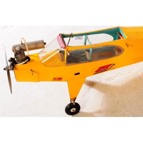 224 - Radio Controlled Plane - a vintage model RC plane fuselage and wings. Wooden construction, in yellow... 