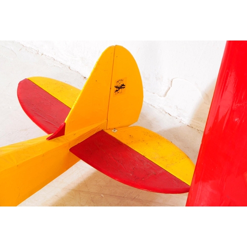 224 - Radio Controlled Plane - a vintage model RC plane fuselage and wings. Wooden construction, in yellow... 